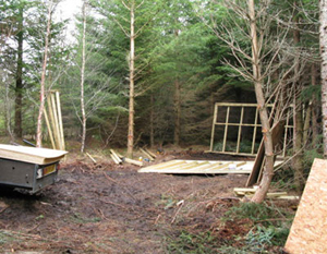 What do woodland owners do about sheds for storage ?