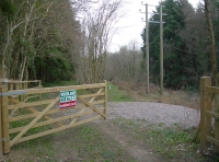 Gated access from the road and parking for Fosse Wood