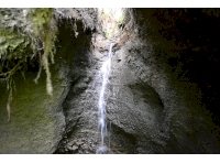 Bottom of a stream, creating a small waterfall