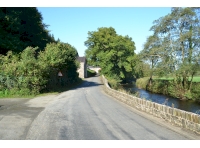 The entrance to the woodland is on the far left of this picture, and the road leading into the small village of Gelli