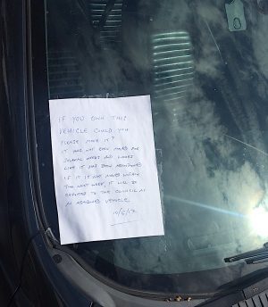 Communicating through a note on the windscreen